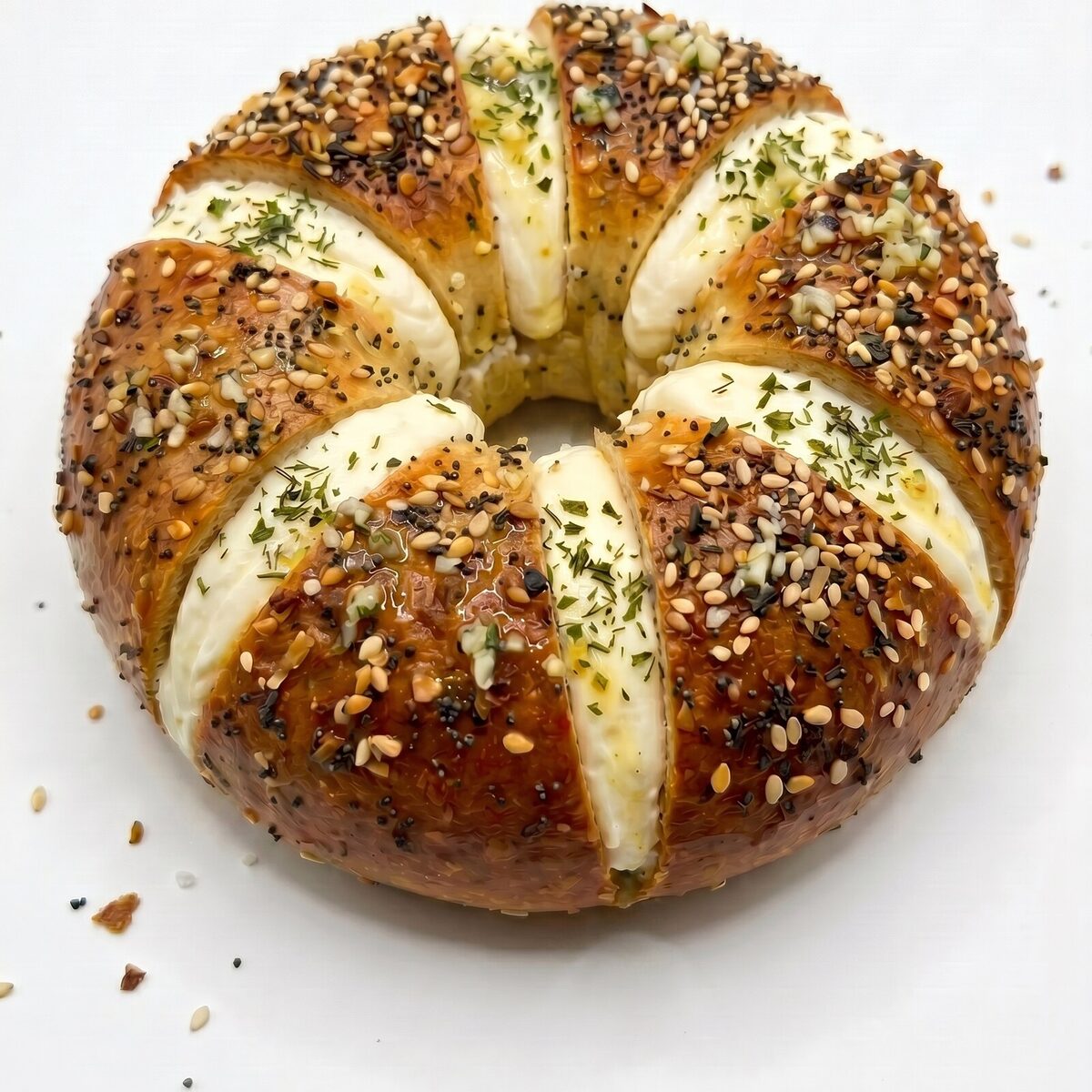 Warm garlic pull apart bagel scored into wedges with whipped cream cheese at Pinochio Newmarket